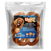 UniQ poslastice za pse, 500 g, jagnjetina na kolutovima od sirove kože (10 cm)